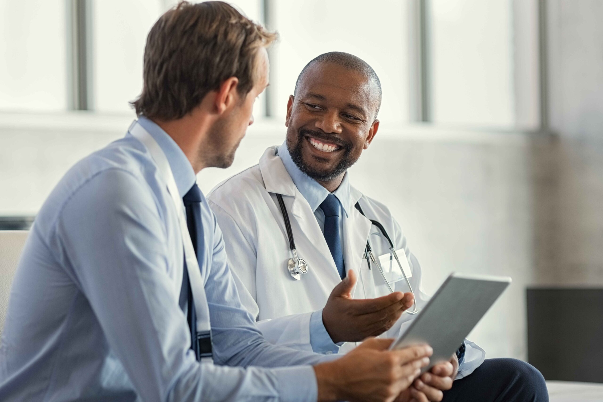 A man discusses Vivitrol treatment with his doctor