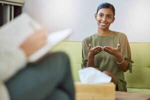 A woman discusses Vivitrol treatment with her therapist.