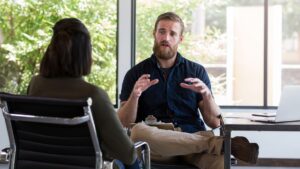 A therapist discussing with his patient the concerns associated with Ketamine treatment.
