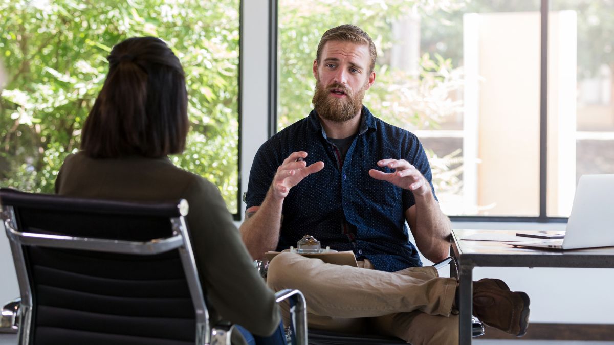 A therapist discussing with his patient the concerns associated with Ketamine treatment.